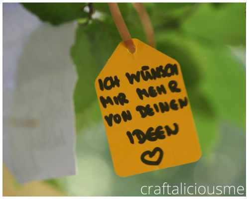 yellow tags wish tree berlin