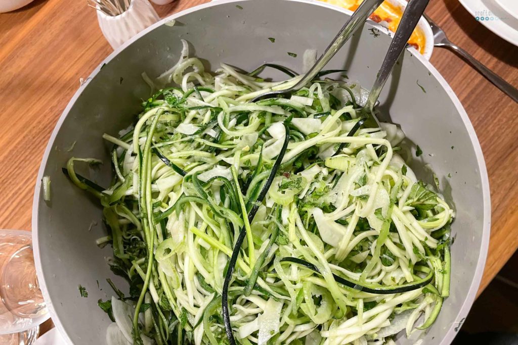Birthday present for mom green ribboned salad in gray bowl