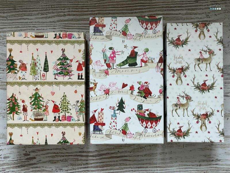 Volunteering at the Christmas Factory shoeboxes with Christmas paper