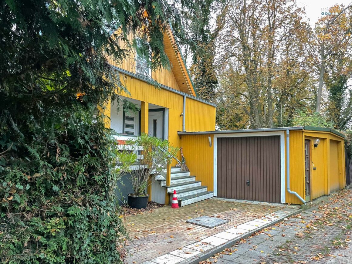 stroll through the neighborhood catching fall vibes yellow house