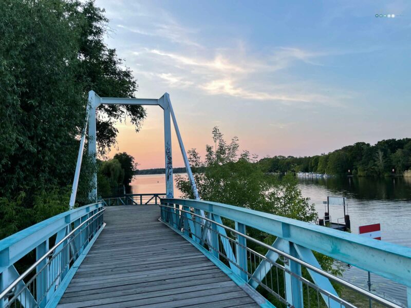 blue bridge over water ways with sunset sky – at the moment